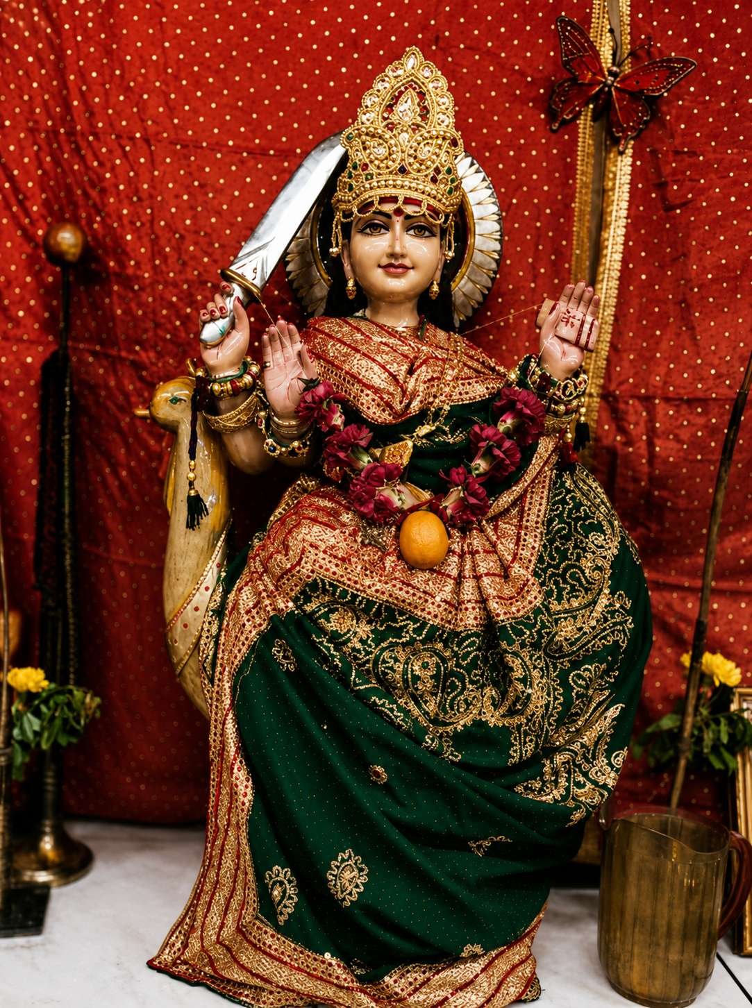 The image depicts a woman adorned in traditional attire, holding a sword and wearing intricate, colorful jewelry, against a red backdrop with decorative flowers.

AI-generated content may be incorrect.